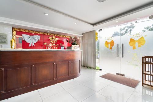 a lobby of a hotel with a reception counter at Collection O Nam Phuong Hoang Hau Near Lotte Mart in Ho Chi Minh City