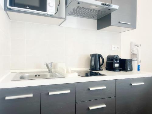 Η κουζίνα ή μικρή κουζίνα στο Pompei - appartement 4 personnes - check in h24 - wifi