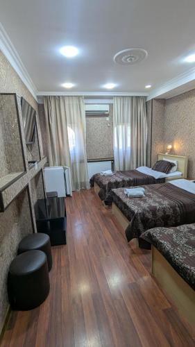 Postel nebo postele na pokoji v ubytování Dkd-bridge Hotel