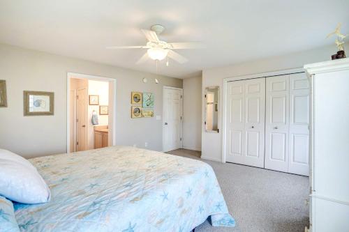 a bedroom with a bed and a ceiling fan at Bowers Beach Vacation Rental 2 Blocks Away! in Frederica
