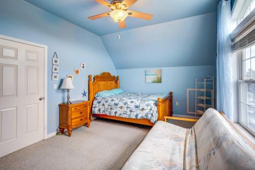 a bedroom with a bed and a ceiling fan at Bowers Beach Vacation Rental 2 Blocks Away! in Frederica