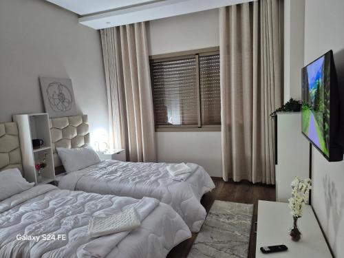 Postel nebo postele na pokoji v ubytování Aeroperla Prestige Casablanca Airport