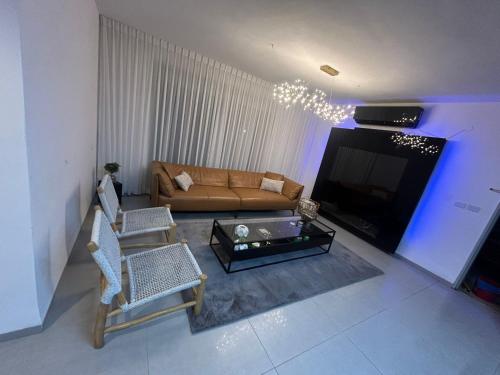 Χώρος καθιστικού στο Amar Luxury