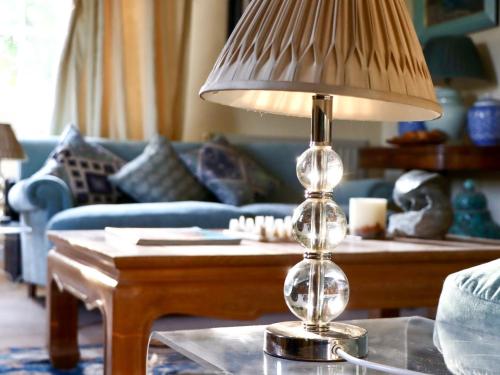 a lamp sitting on a table in a living room at 5 Bed in Fitzhead 95570 in Fitzhead