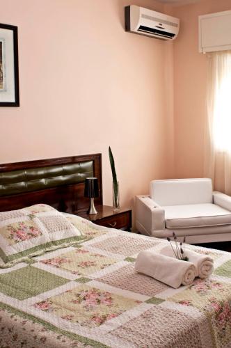 Ένα ή περισσότερα κρεβάτια σε δωμάτιο στο Hotel San Martin