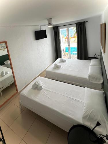 Postel nebo postele na pokoji v ubytování Hostal Blanc Lloret