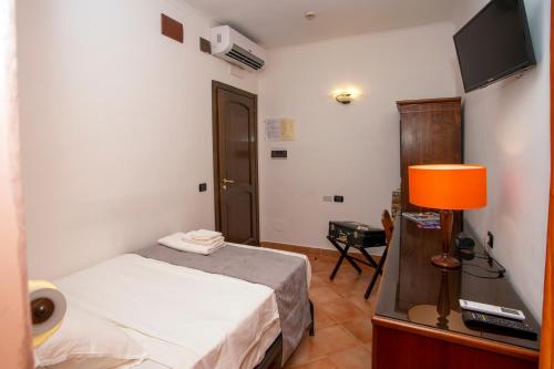 Postel nebo postele na pokoji v ubytování Hotel Neapolis
