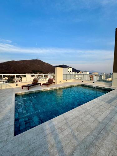 a swimming pool on the roof of a building at Luxury Studio in Salta