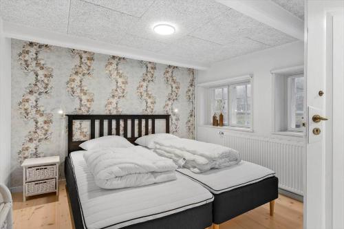 Ένα ή περισσότερα κρεβάτια σε δωμάτιο στο 0208-Romo-Grammarkvej-4