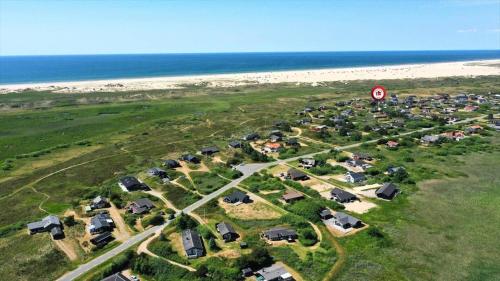 an aerial view of a group of houses next to the beach at 0090-Romo-Lakolk-256 in Lakolk