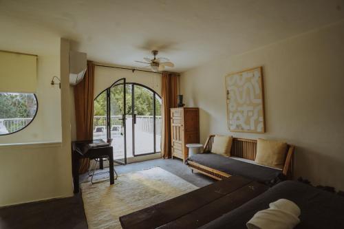 a living room with a couch and a table at MORO Marrakech Boutique Hôtel in Marrakech