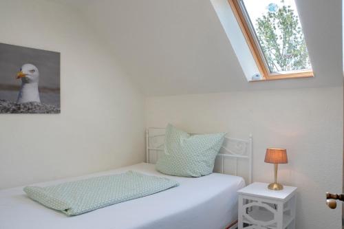 Postel nebo postele na pokoji v ubytování Ferienhaus Buttforde
