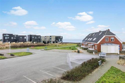 an empty parking lot in front of a building at 0372-Romo-Sonder-Frankel-8 in Havneby