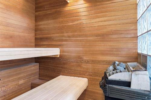 a sauna with a bench and a tub in it at 0372-Romo-Sonder-Frankel-8 in Havneby