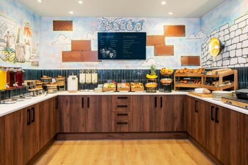 a fast food restaurant with a counter with food at Hotel Indigo York by IHG in York