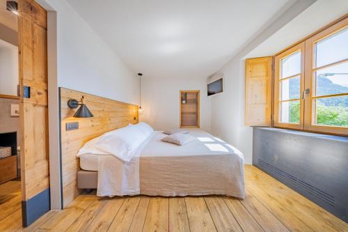 Postel nebo postele na pokoji v ubytování Casa Pasini-Foresteria