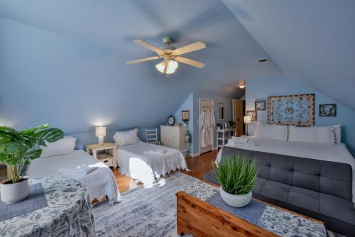 a bedroom with two beds and a ceiling fan at Bama Lakeside Retreat in Tuscaloosa