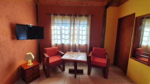 TV a/nebo společenská místnost v ubytování ADM chalé Chiaradia