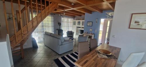 a living room with a couch and a table at Ferienhaus Strandrubin in Baabe