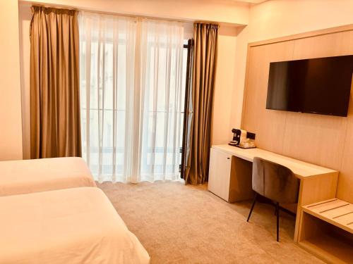 TV a/nebo společenská místnost v ubytování CM111Apparthotel