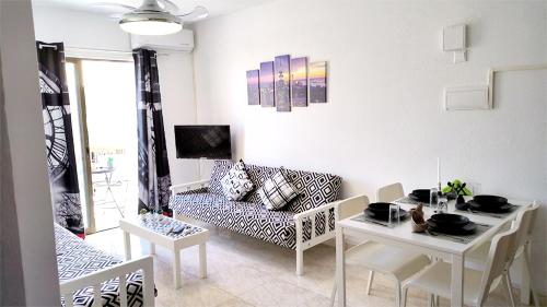 a living room with a couch and a table at SPECIAL OFFER -70 Percent OFF - Sleep 5 - Best Location - Free Parking in Ayia Napa