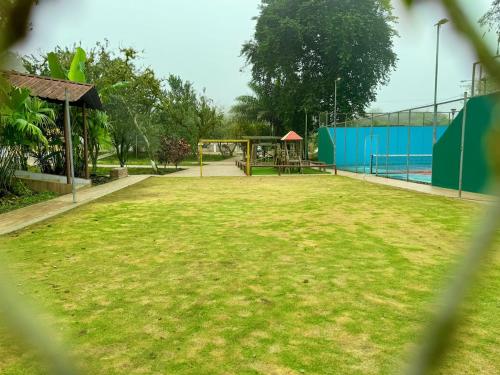a park with a gazebo and a playground at Forest 15 min from Manta Beach in Pacoche