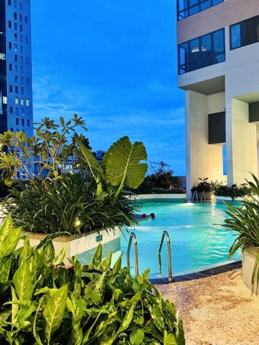 a swimming pool in the middle of a building at YAKA Trizen Luxury Apartments - 53rd and 51st Floor with Stunning Views in Colombo