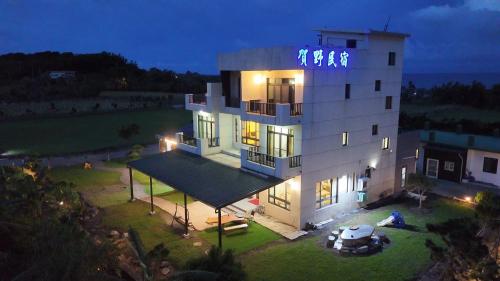 a large white building with a sign on top of it at Zhitian Heye in Chenggong
