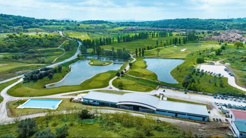an aerial view of a golf course with a lake at B&B Angelo e Graziella in Monterosi
