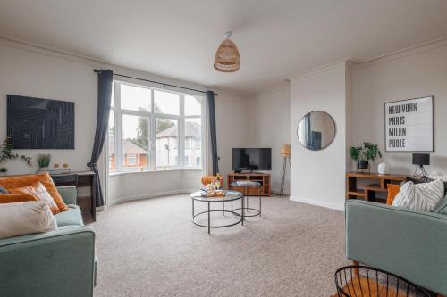 a living room with two couches and a tv at Parkstone Central by Grandeur Property in Parkstone