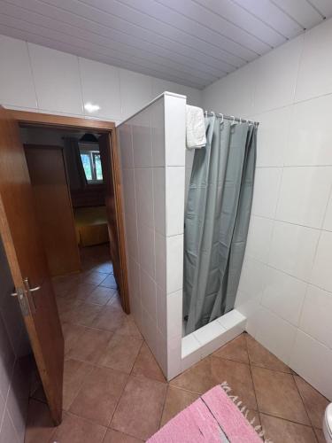 a bathroom with a shower with a shower curtain at Casa da Quinta De S. Martinho in Vila Real