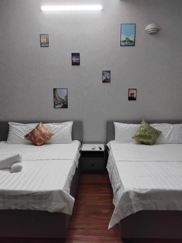 Postel nebo postele na pokoji v ubytování Hotel Loan Ðài