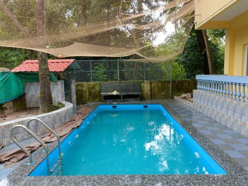 Πισίνα στο ή κοντά στο 2BHK Apartment in Majorda