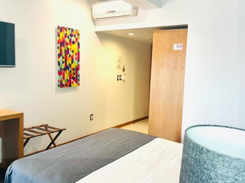 Concept Hotel - Centro Zamoraにあるベッド