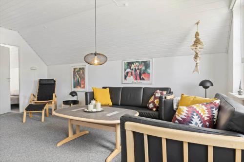 a living room with a couch and a table at 0456-Romo-Vestergade-227-Ap-15 in Sønderby