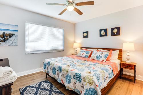 a bedroom with a bed and a ceiling fan at Palm Coast Escape with Outdoor Oasis 6 Mi to Shore! in Palm Coast