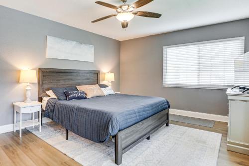 a bedroom with a bed and a ceiling fan at Palm Coast Escape with Outdoor Oasis 6 Mi to Shore! in Palm Coast