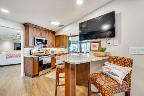 a kitchen with a large kitchen island with a counter top at Water Views and Dock Tranquil Matlacha Island Home in Matlacha