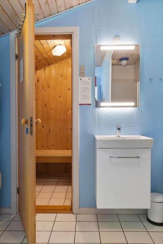 a bathroom with a toilet and a sink and a mirror at 0651-Toftlund-Skikkild-bjerge-20 in Toftlund