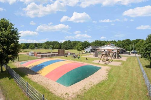 a playground with a rainbow painted on it in a park at 0651-Toftlund-Skikkild-bjerge-20 in Toftlund