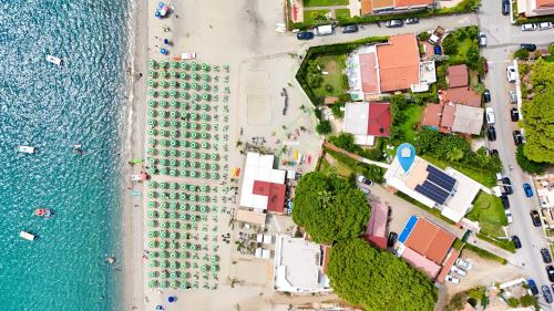 an aerial view of a beach and the water at CALALUNGA PIETRAGRANDE - Exclusive Shoreline Haven in Montepaone Lido
