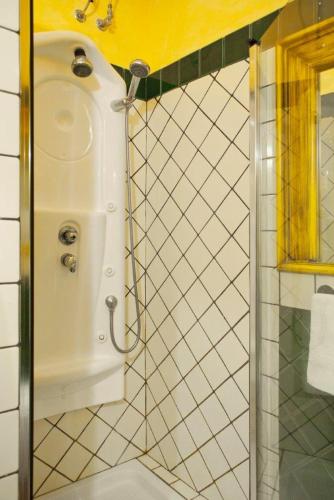 a bathroom with a shower with a sink at Dimora Storica Castello Otranto in Otranto
