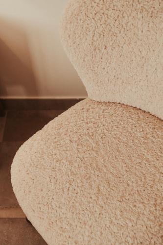 a close up of a white rug on the floor at Rondaia, a Winery & Fincahotel-Agroturismo in Tramuntana in Esporles