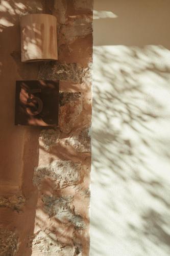 a picture of a lightswitch on a brick wall at Rondaia, a Winery & Fincahotel-Agroturismo in Tramuntana in Esporles