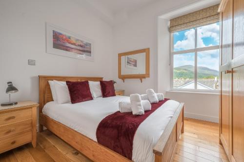 En eller flere senge i et værelse på Chaucer Apartment