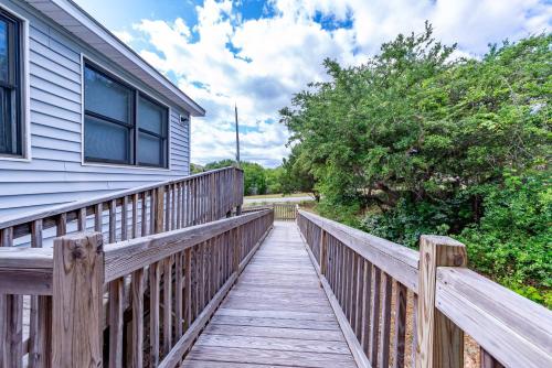 a wooden walkway leading to a house at Duck Redux - D0416 in Duck