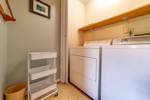 a small kitchen with a refrigerator and a stove at Duck Redux - D0416 in Duck