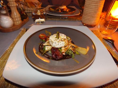 a plate of food sitting on a table at Palm Dades in Boumalne