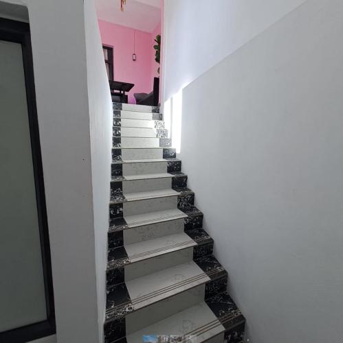 a staircase in a house with black and white at villa atomium in Midlands Station