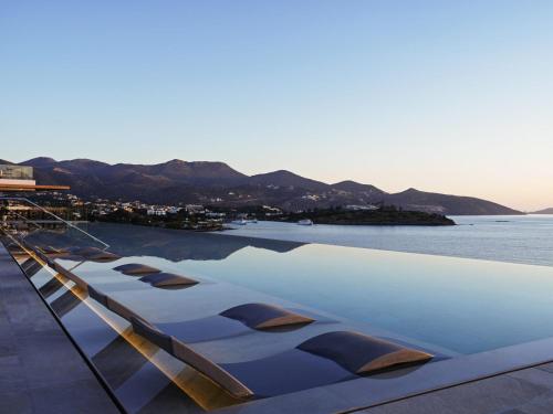 a view of the ocean from the deck of a boat at NIKO Seaside Resort MGallery in Agios Nikolaos
